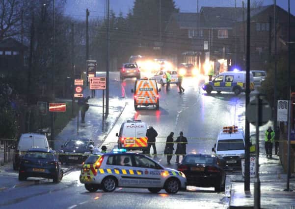 Police seal off Bolton Road in Ashton after a man was shot