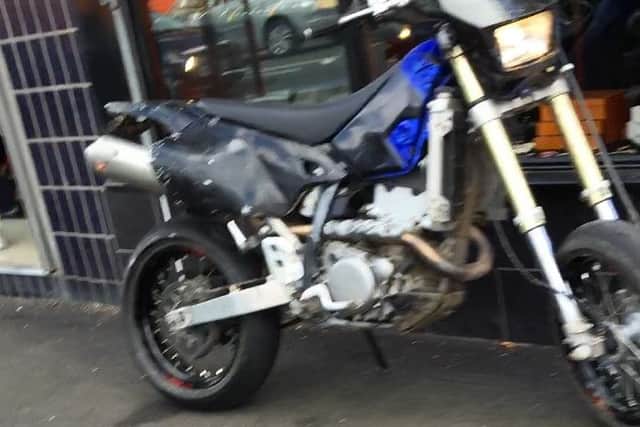 The getaway motorbike outside the jewellers