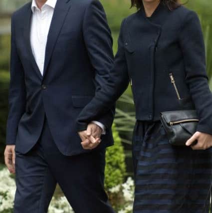 Prime Minister David Cameron and wife Samantha arrive at 10 Downing Street in central London after the General Election put his Conservative Party on the brink of securing an absolute majority in the House of Commons