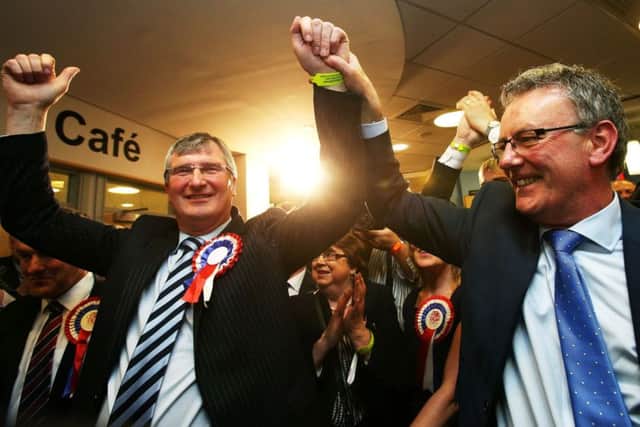 UUP candidate for Fermanagh and South Tyrone Tom Elliott (left) celebrates with party leader Mike Nesbitt after his General Election victory in the Omagh Leisure centre