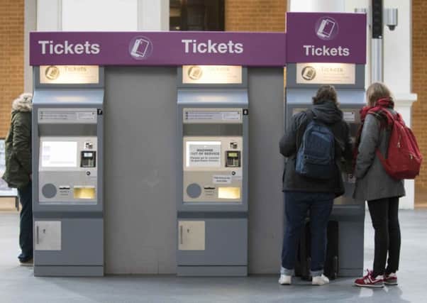 Commuters buying their tickets