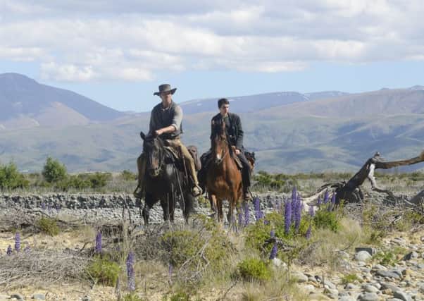 Michael Fassbender as Silas and Kodi Smit-McPhee as Jay Cavendish in Slow West
