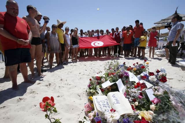 A beachside vigil in Tunisia yesterday