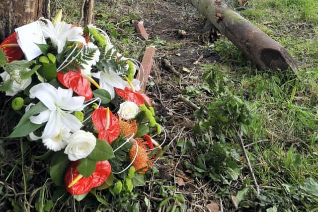 Tributes: Flowers at the scene of the crash