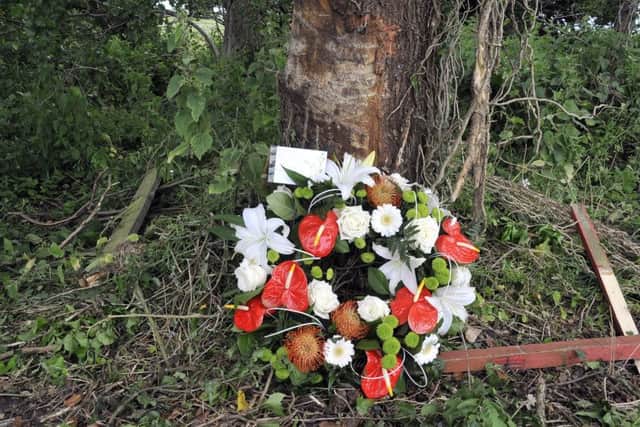 Tributes: Flowers at the scene of the crash