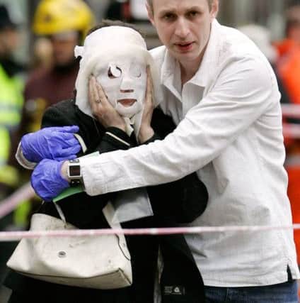 Walking wounded leaving Edgware Road tube station to be treated at the London Hilton Metropole on Edgware Road following the terrorist attacks on the capital 10 years ago today
