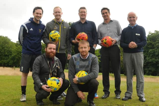 Wigan Evening Post reporters try out FootGolf, a sporting infusion of football and golf, new to Haigh Hall Golf Club, Wigan, back row from left, James Illingworth, Greg Farrimond, Paul Kendrick, Chris Derbyshire from Wigan Leisure and Culture Trust (WLCT), Haigh Hall Golf Club pro Ian Lee,  front from left, Tom McCooey and Jon Peake