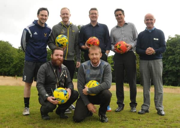 Wigan Evening Post reporters try out FootGolf, a sporting infusion of football and golf, new to Haigh Hall Golf Club, Wigan, back row from left, James Illingworth, Greg Farrimond, Paul Kendrick, Chris Derbyshire from Wigan Leisure and Culture Trust (WLCT), Haigh Hall Golf Club pro Ian Lee,  front from left, Tom McCooey and Jon Peake