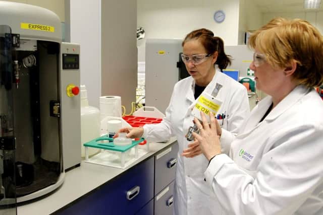 Technician Janette Williams (right) tests a sample of water at a United Utilities laboratory in Warrington, to check for traces of the microscopic bug cryptosporidium, which has been found in the water supply in Lancashire. PRESS ASSOCIATION Photo. Picture date: Monday August 10, 2015. Hundreds of thousands of people in Lancashire have been warned to continue boiling tap water as the bug can cause sickness and diarrhoea. See PA story ENVIRONMENT Water. Photo credit should read: Peter Byrne/PA Wire