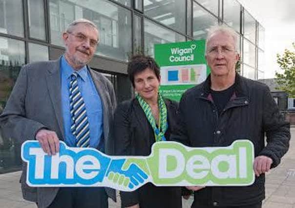 Wigan Council leader Lord Peter Smith, Chief Executive Donna Hall and deputy leader David Molyneux