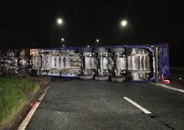 The overturned lorry on the A580