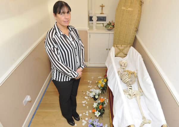 Mandy Case the owner of Haydock Funeral Service in St Helens, Lancs., with Arthur the Skeleton