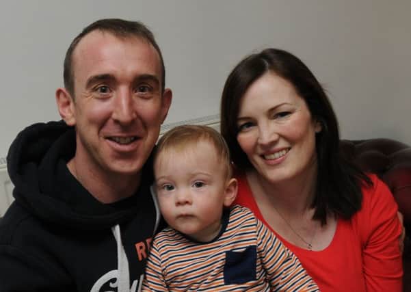 James Hinnigan from Ashton-in-Makerfield with partner Wendi Pickering, right, and son Cameron, 18-months-old