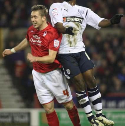 Nathan Ellington battles with Forest's Luke Chambers