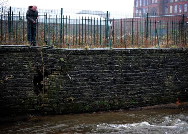 Mark McLoughlin from Wigan is concerned about the safety of a retaining wall on the River Douglas near Pottery Road, after several large cracks and holes appeared after the Christmas floods