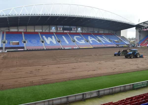 Work gets underway on re-laying the DW Stadium pitch