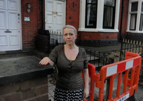 Stella Blackledge outside her home at the scene of an incident where a car hit the wall