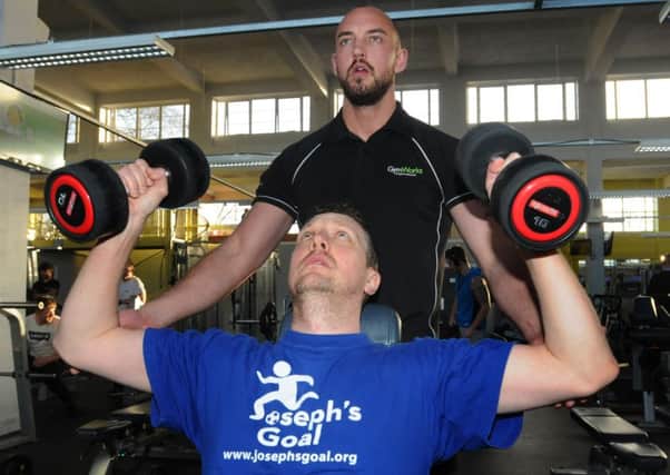 Wigan Evening Post reporter Paul Kendrick in the gym with personal trainer Ryan Garnett, at Gym Works, Euxon Lane, Chorley