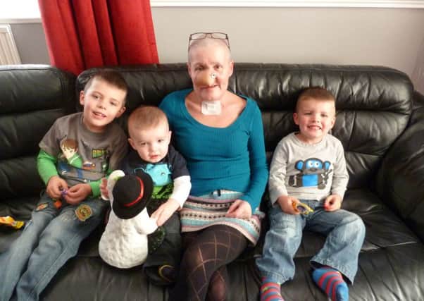 Andrea with grandsons (left to right) Cooper, Ellis and Charlie