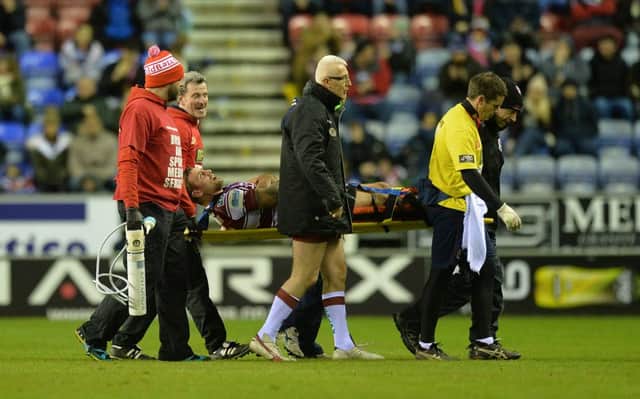Michael McIlorum is stretchered off the field on Saturday