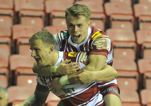 Dom Manfredi is congratulated for his match-winning try by Lewis Tierney