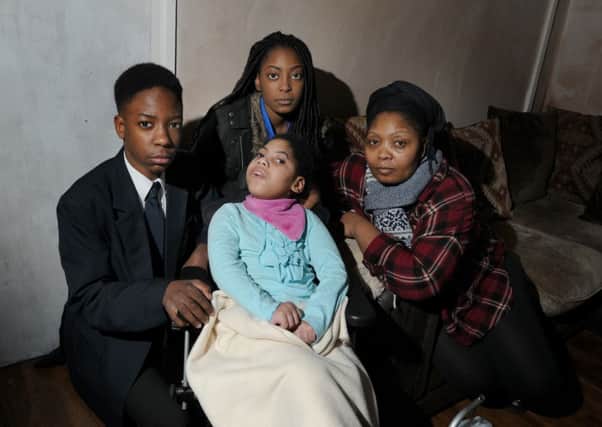 Patience Mabena with her children, from left, Bradley, 13, Kelsey, six, and Cleopatra, 16, they were victims of racist attacks