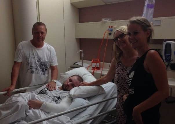 Mark in hospital with mum Julie, dad Malcolm and girlfriend Caro van Laak
