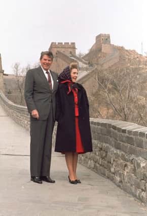 Former President Ronald Reagan and his wife Nancy Reagan stand on the Great Wall in Peking, China, in 1984. See letter