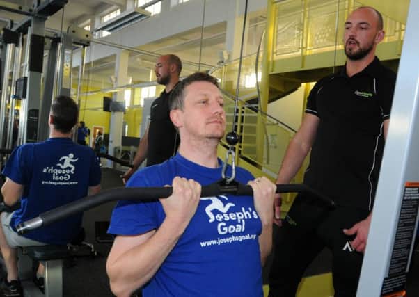 Wigan Evening Post reporter Paul Kendrick in the gym with personal trainer Ryan Garnett, at Gym Works, Euxon Lane, Chorley.