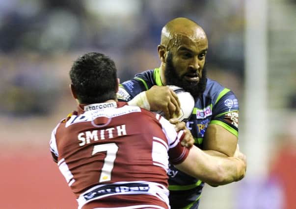 Jamie Jones-Buchanan is held by Matty Smith