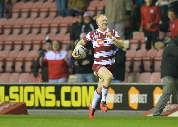 Liam Farrell races away for a try against Widnes