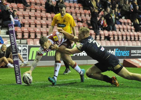 Wigan Warriors' Dominic Manfredi scores his sides 4th try