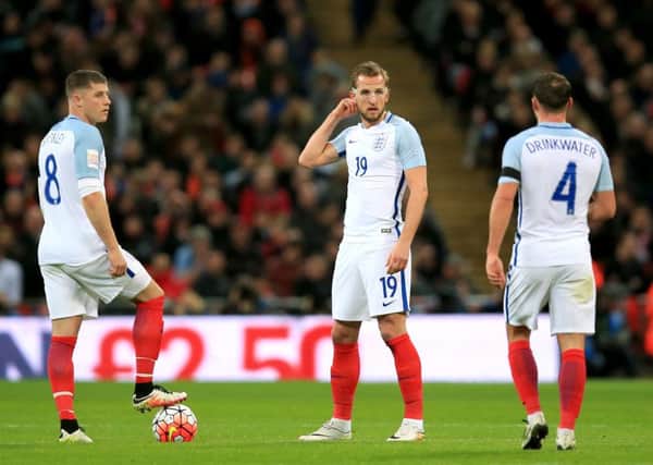 Englands Ross Barkley, Harry Kane and Danny Drinkwater dejected after the Netherlands score their second goal