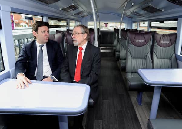 Leigh MP Andy Burnham and TfGM committee chair Coun Andrew Fender on the busway