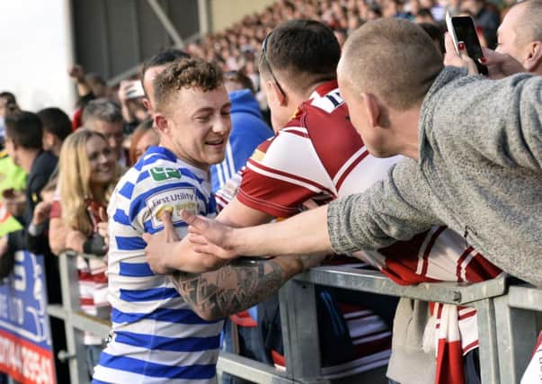 Josh Charnley with Warriors fans on Good Friday