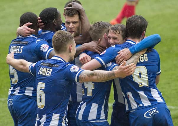 Latics players celebrate their win over Coventry on Saturday