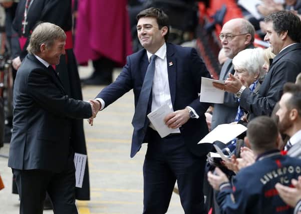 Shadow home secretary Andy Burnham shakes hands with former Liverpool player and manager Kenny Daglish before the last memorial service to be held at Anfield, Liverpool, to mark 27 years to the day since the tragedy claimed 96 lives