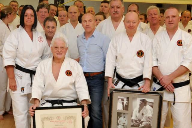 BKA chairman Brian Seabright (blue shirt), with sensei Tony Christian and a few of his senior black belts