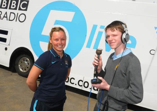 Manchester City Women's player Becky Abbott, left, is interviewed by pupil Callum Jones, 14.