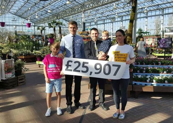 Matthew Dickinson, Head of Indoor Retail at the garden centre, with his son Isaac, Matthew Bent (owner of the centre) and his son, and Emily Clough who is a massive supporter of the Trust. She has two young boys with Cystic Fibrosis