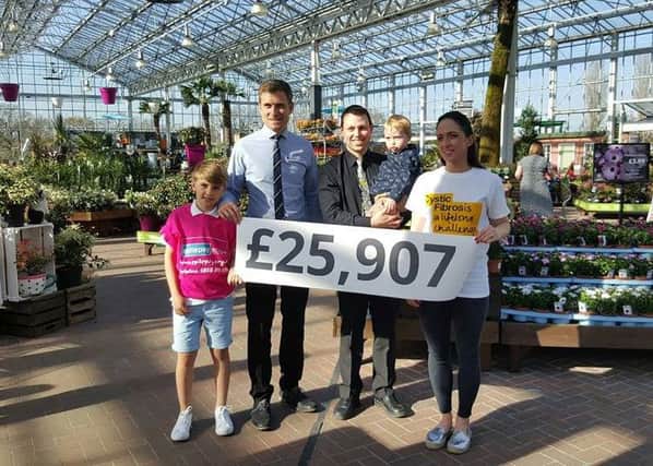 Matthew Dickinson,  Head of Indoor Retail at the garden centre, with his son Isaac,  Matthew Bent (owner of the centre) and his son, and Emily Clough who is a massive supporter of the Trust. She has two young boys with Cystic Fibrosis