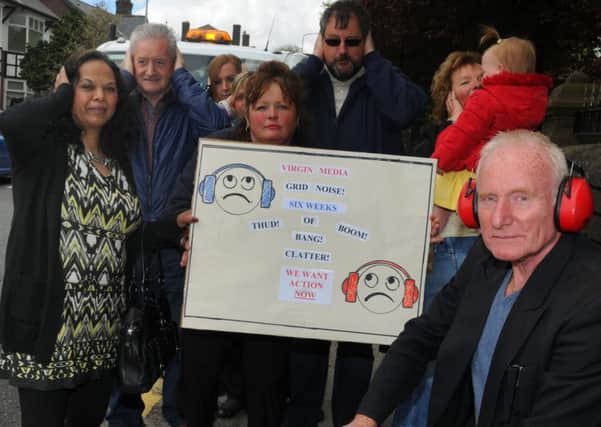 Mike Gibbons, right, with other residents from Orrell Road, Orrell, who were angry about a noisy manhole cover last year