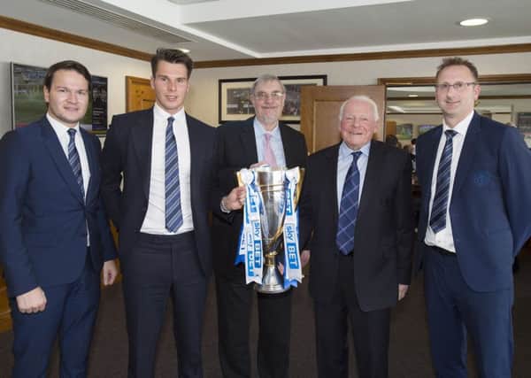 Latics chief executive Jonathan Jackson (right) with, from left, director Matt Sharpe, chairman David Sharpe, council leader Lord Peter Smith and club owner Dave Whelan
