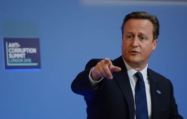 Prime Minister David Cameron speaks during the final session at the Anti-Corruption Summit. See letters