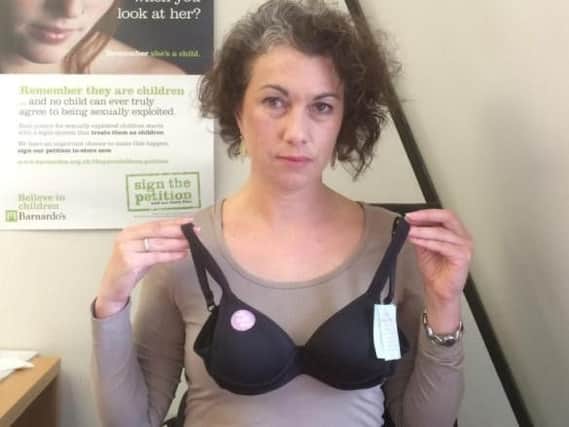 Sarah Champion MP with the children's bra which she says is "too sexualised"
