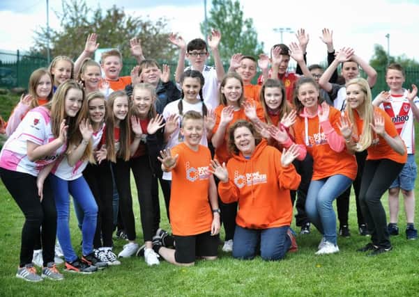 Pictured centre,  Mackenzie Maddison (13), who helped organise the event and Bone Cancer Research Community Fundraiser, Dee McKenna with some of Harrison's friends