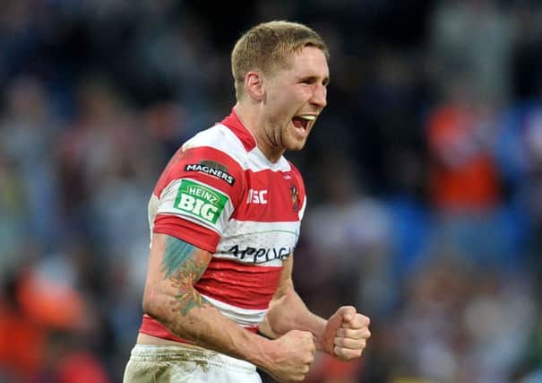 Wigan Warriors' Sam Tomkins celebrates after his team's victory during the 2013 Super League Magic Weekend