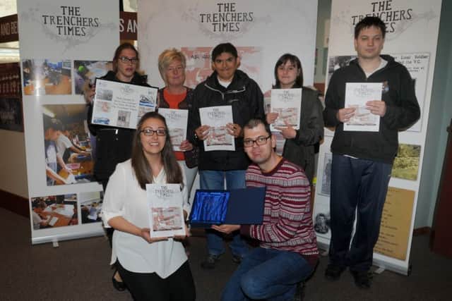 Project manager Denise Colbert, front left, with members of True Colours celebrate producing Trencher Times, a new heritage project based around WW1 events, inspired by Wiper Times, a trench magazine published by British soldiers, the launch was held at the Museum of Wigan Life