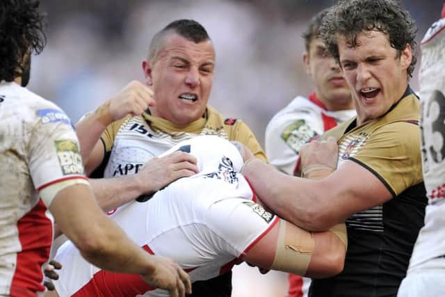 Chris Tuson throws punches during heated exchanges with St Helens