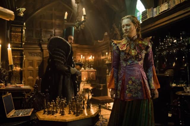 Alice (Mia Wasikowska) returns to the whimsical world of Underland and meets Time (Sacha Baron Cohen)